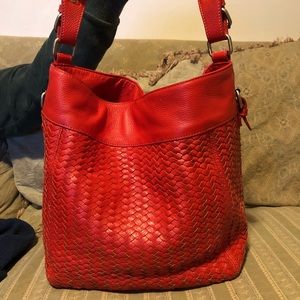 Orange woven Johnston & Murphy bag with wristlet